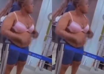 Watch as Nigerian woman strips at banking hall, demands that her money’ be returned 