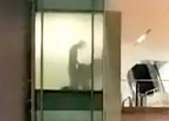 Couple caught romping at work through office window