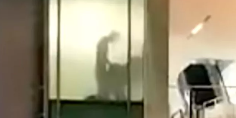 Couple caught romping at work through office window