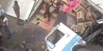 Truck falls off Lagos bridge, lands on bus station